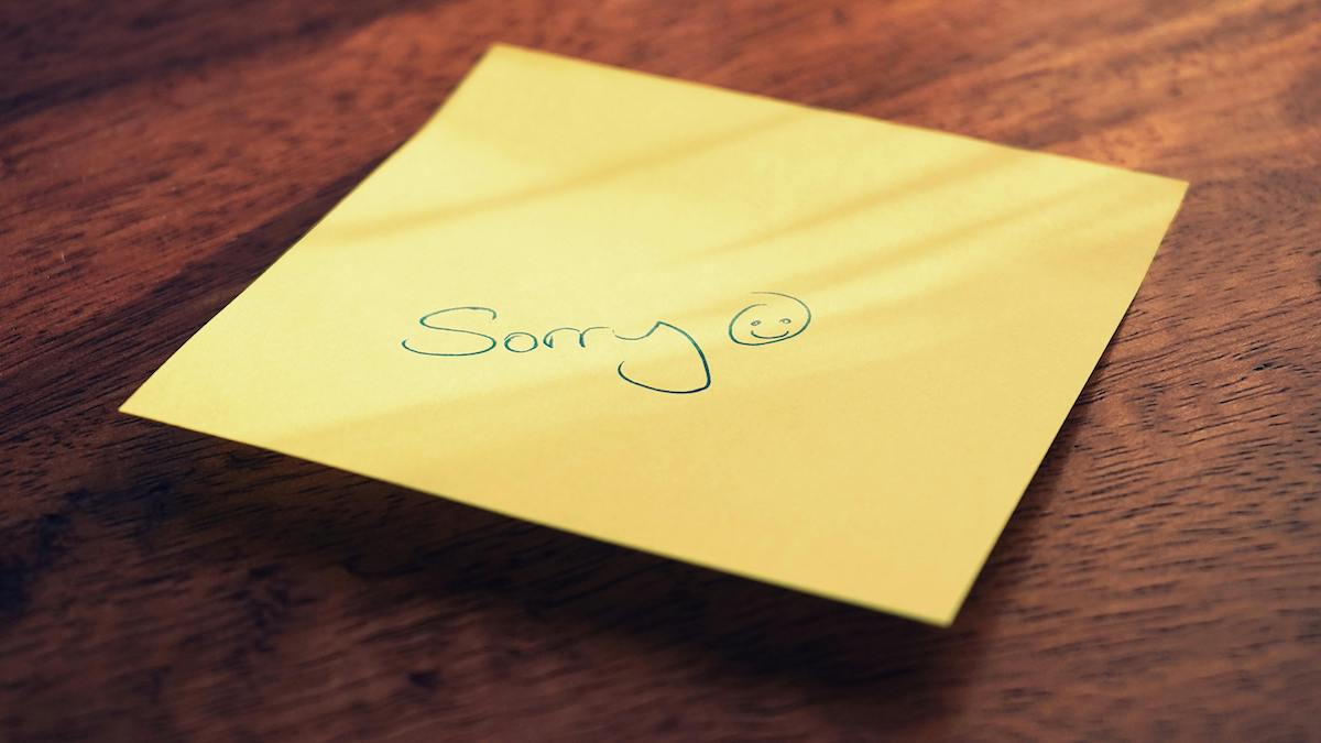 Post-it note with the word sorry.